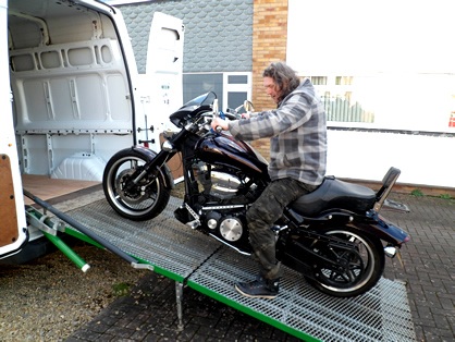 Stu loading his motorbike into the AVIT Delivered van.